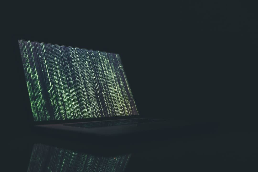 Image of a laptop displaying code