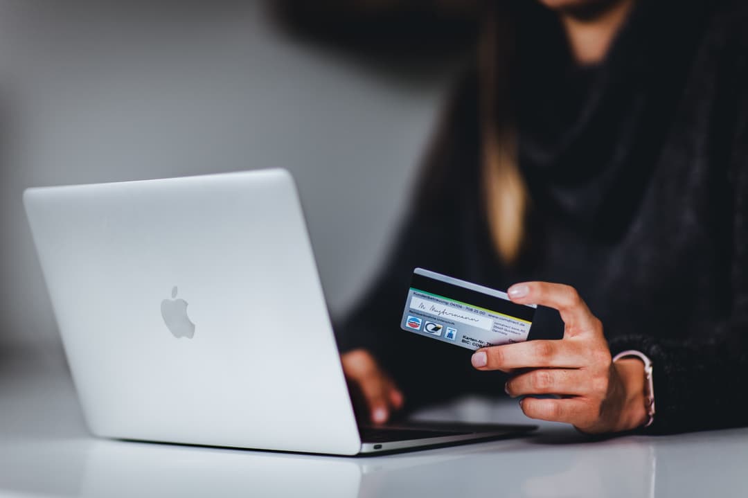 An image of a girl making an online payment.