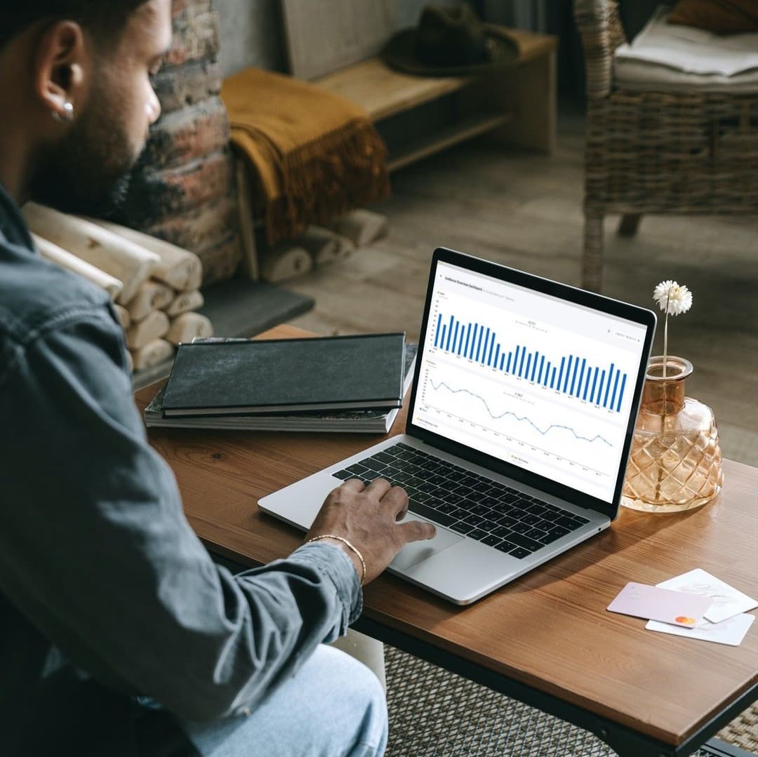 Man sitting in front of a laptop