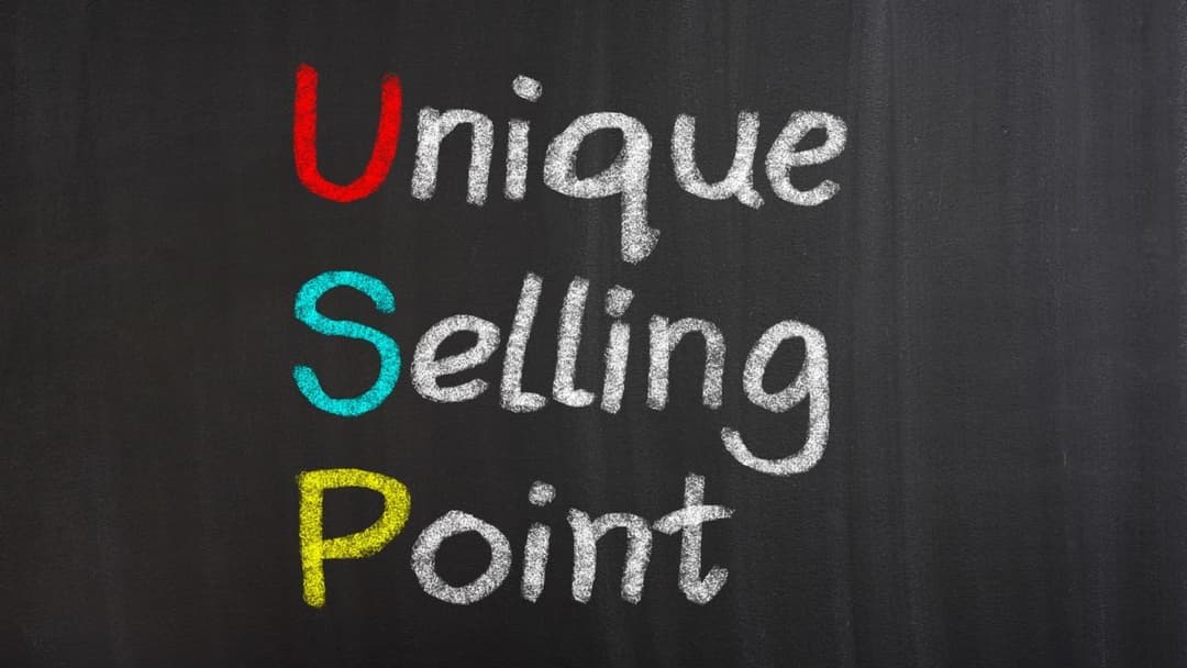 Colored chalk text "Unique Selling Point" on a blackboard, symbolizing the core of lead magnets strategy in marketing and business differentiation.