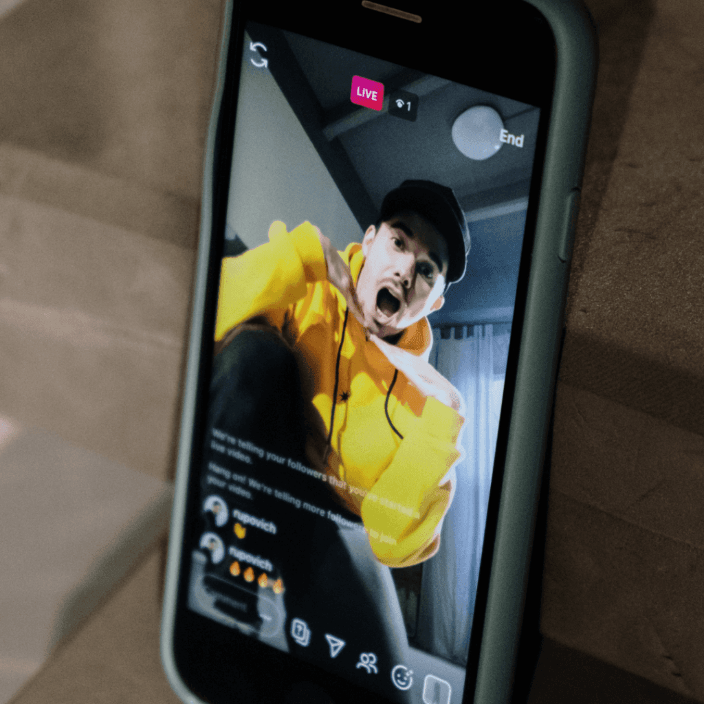 "Smartphone displaying a lively Instagram Live session, a key engagement metric for Instagram Insights Reports."