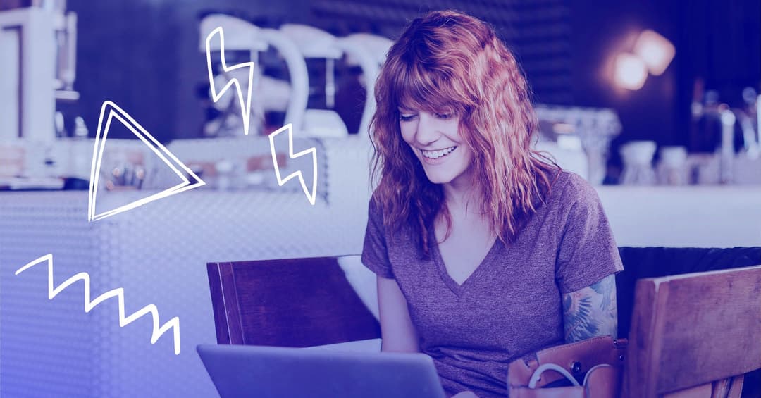 Woman working on a laptop in a creative space, symbolizing productivity and tools like Google Looker Studio.