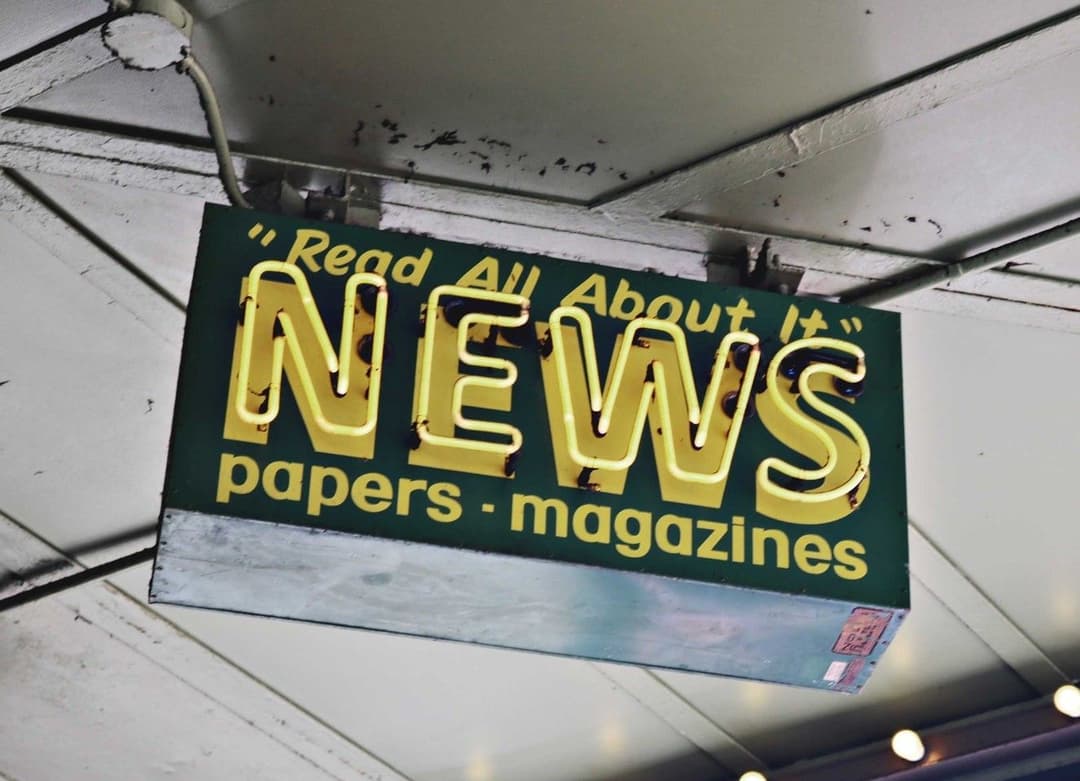 Sign displaying the word "News"