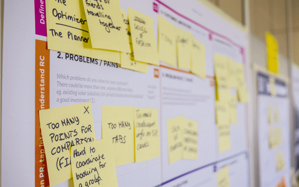 Detail of a project planning board with sticky notes, symbolizing the collaborative and strategic planning stage of a Digital Agency Workflow.
